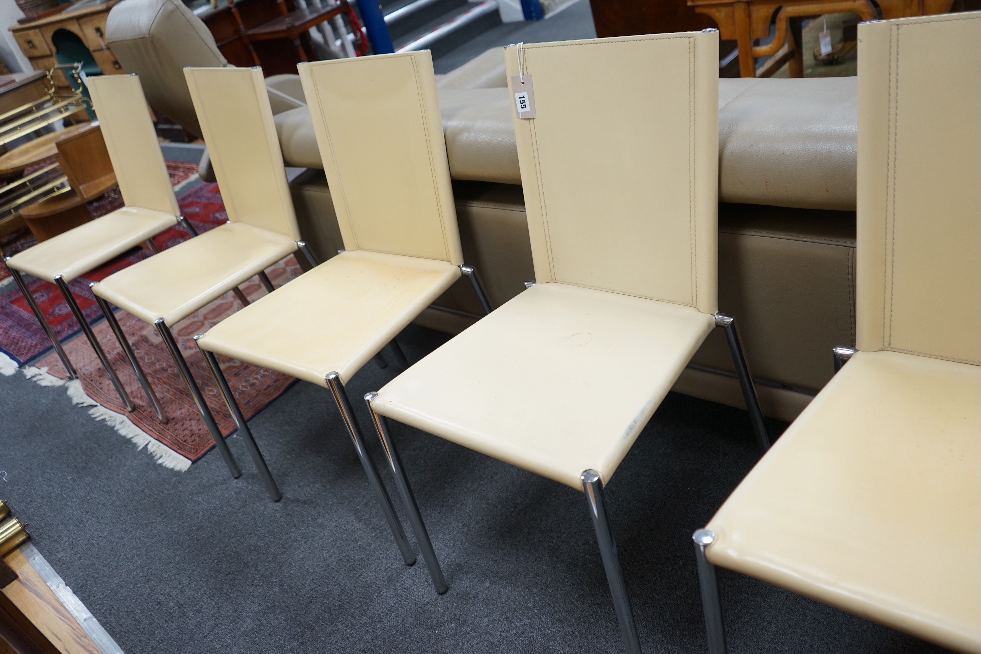 A set of five Italian cream leather and chrome dining chairs